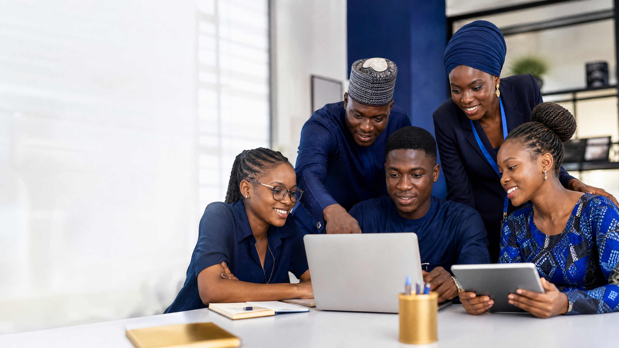 African professionals collaborating in a technology and education setting